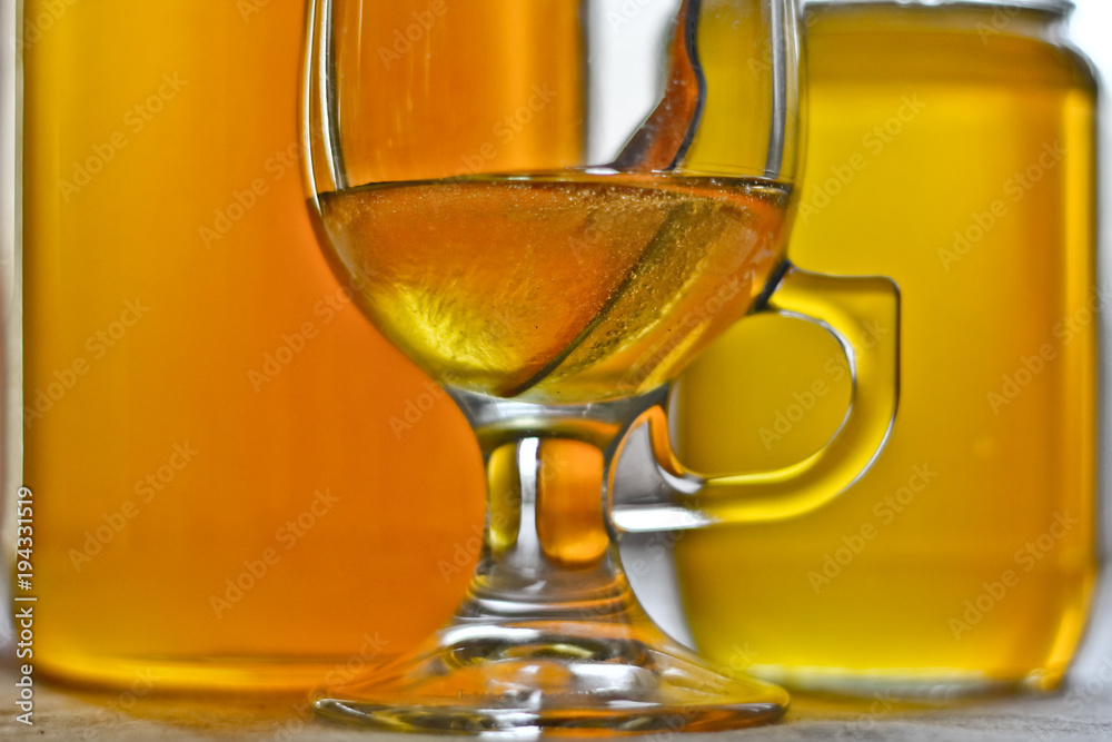 Honey in a cup and jars Honey in a cup and jars