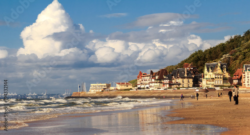 TROUVILLE, FRANCE. Unidentified tourists on the coast of Trouville, Normandy, France. photo