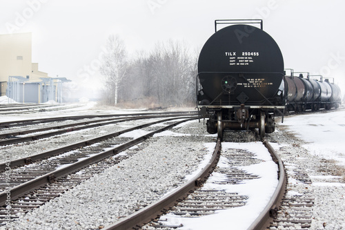 Tanker train cars on a foggy winter day