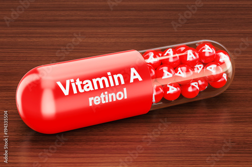 Vitamin A capsule on the wooden table. 3D rendering