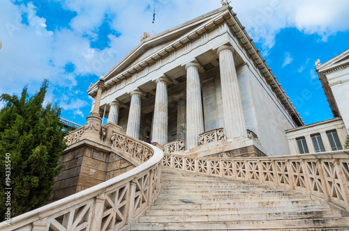 Fototapeta Naklejka Na Ścianę i Meble -  National library in the center of Athens Greece. One of the Trilogy of neoclassical buildings including the Academy of Athens and the original building of the Athens University in Panepistimiou street