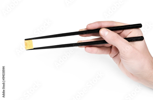 hand holding cheese in Chinese sticks