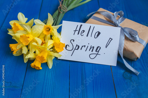 Fototapeta Naklejka Na Ścianę i Meble -  Flowers Greeting Card . Spring easter background with daffodils bouquet and gift