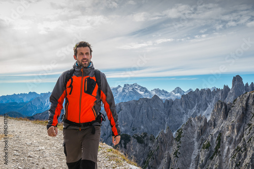 man in italian dolomites, in south tyrol, beautiful mountains scenery with man in italian alps