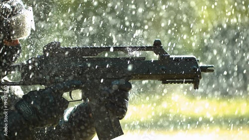 Gun in the rain, slow motion