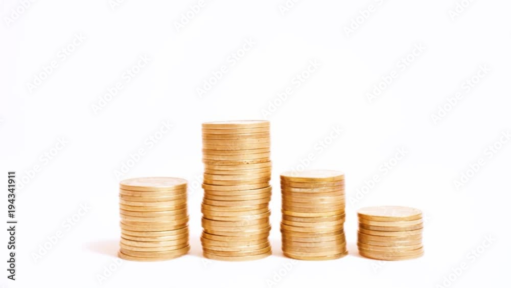 Stacks of raising and decreasing coins on timelapse Stacks of raising and decreasing coins on timelapse