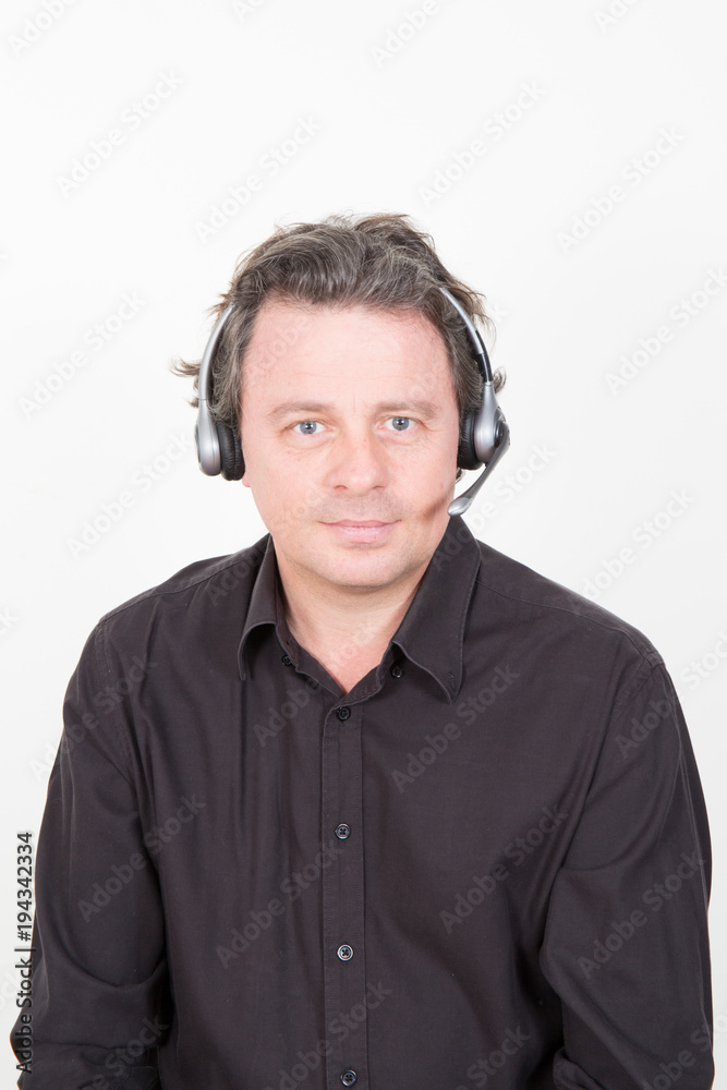 Male consulting manager with headset in office Male consulting manager with headset in office