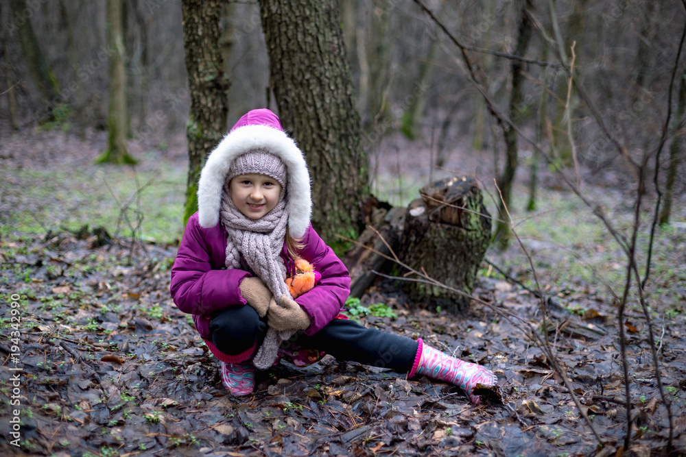 Cute little girl posing in autumn forest Cute little girl posing in autumn forest