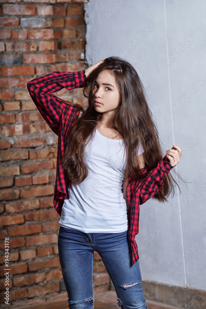 portrait fashion beautiful teen girl. Girl hipster brunette asian. Stylish  fashion teenager clothed in casual clothes looking expression daring.  fashion concept. Stock Photo