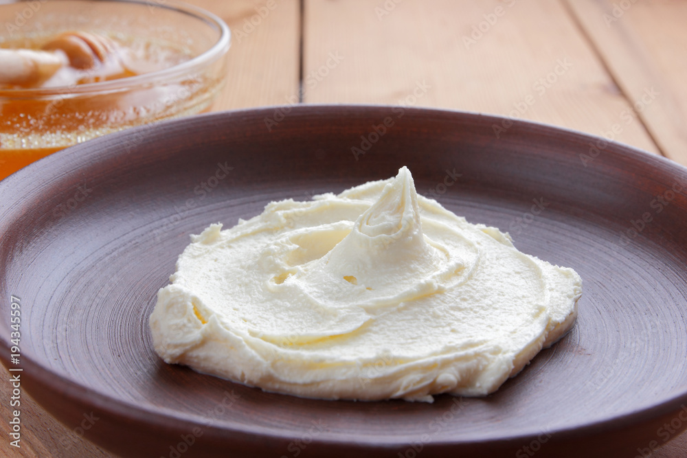 Sour cream, cream, fresh sour cream in pottery on a wooden background, dairy products and honey, wooden board, French breakfast, healthy food, sour cream and honey in a rustic style, minimalism, copy Sour cream, cream, fresh sour cream in pottery on a wooden background, dairy products and honey, wooden board, French breakfast, healthy food, sour cream and honey in a rustic style, minimalism, copy