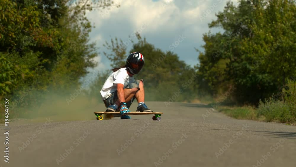 Longboarding on the road, slow motion Longboarding on the road, slow motion