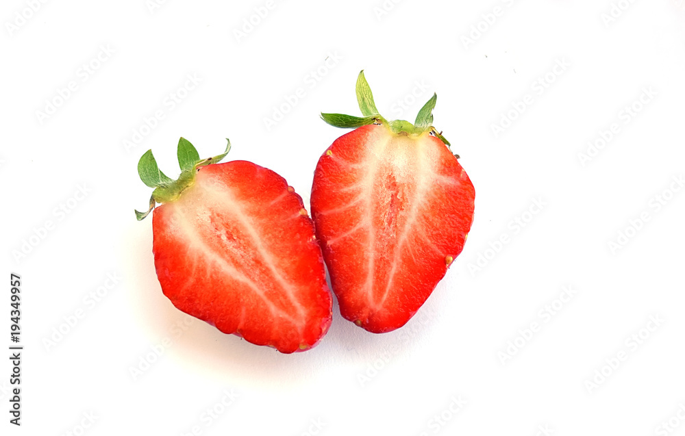 Two slice of half strawberry and leaves Two slice of half strawberry and leaves
