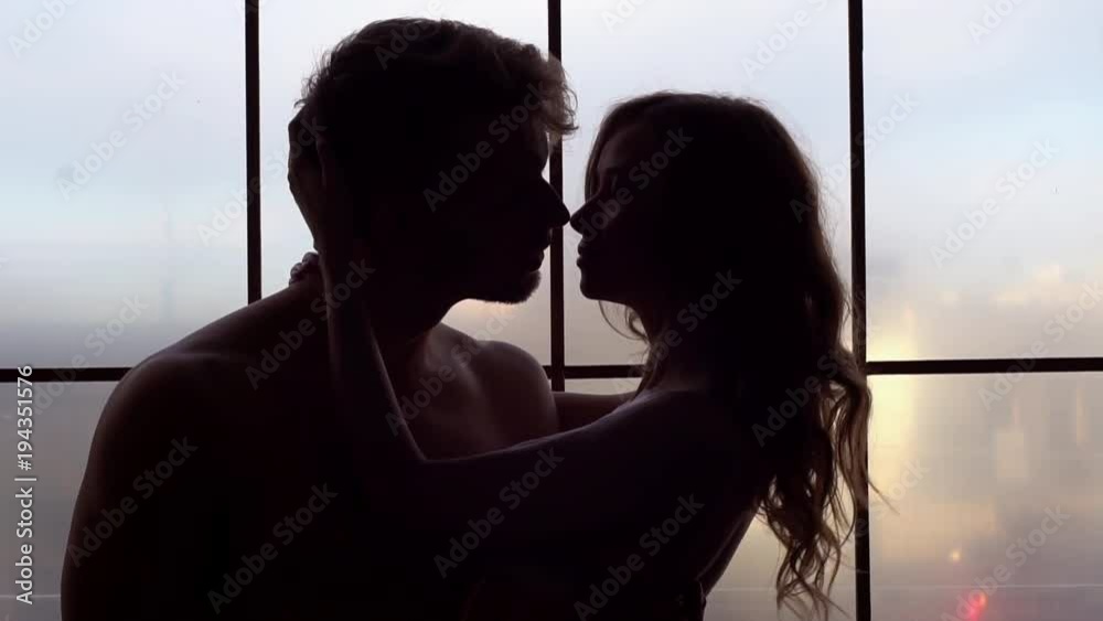 Young couple at home together saint valentine's day concept kissing shirtless
