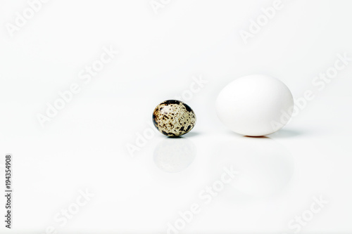 Two eggs of different sizes. Business concept.