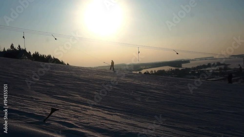 landscape winter slides ski resort,ski lift,going down downhill snowboarders and skiers.