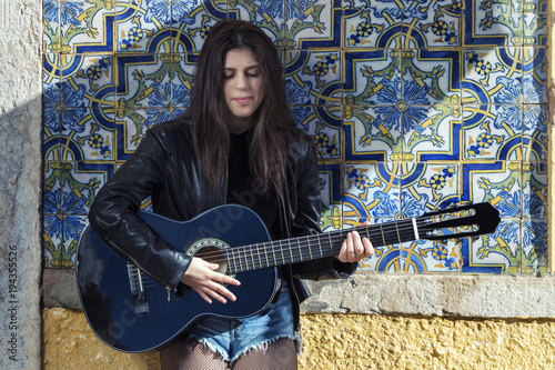 Young woman with classic guitar