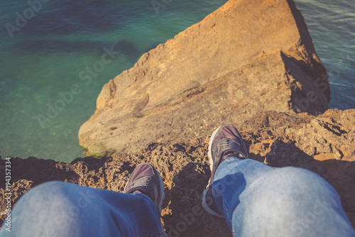 At the edge of the cliff