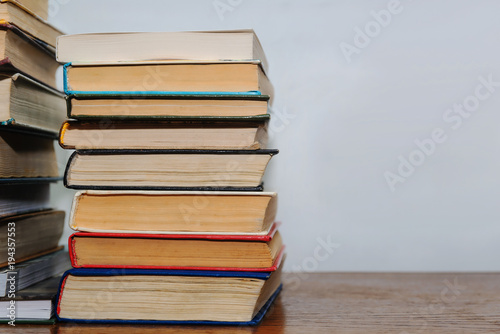Stack of different books on a table