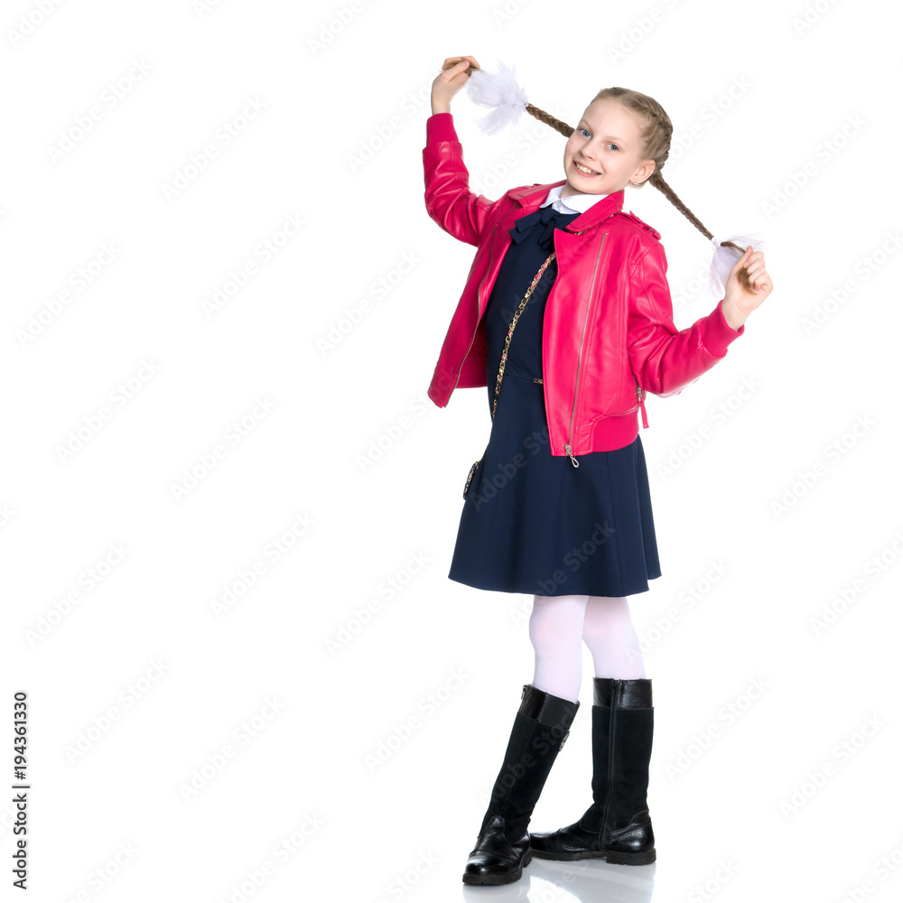 The little girl is pulling herself in pigtails. The little girl is pulling herself in pigtails.