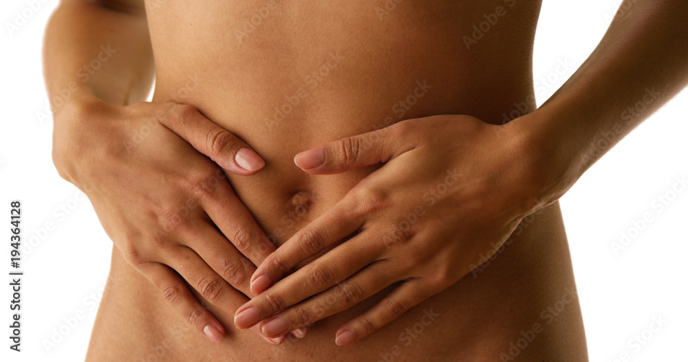 Close up of woman with stomach cramps on white
