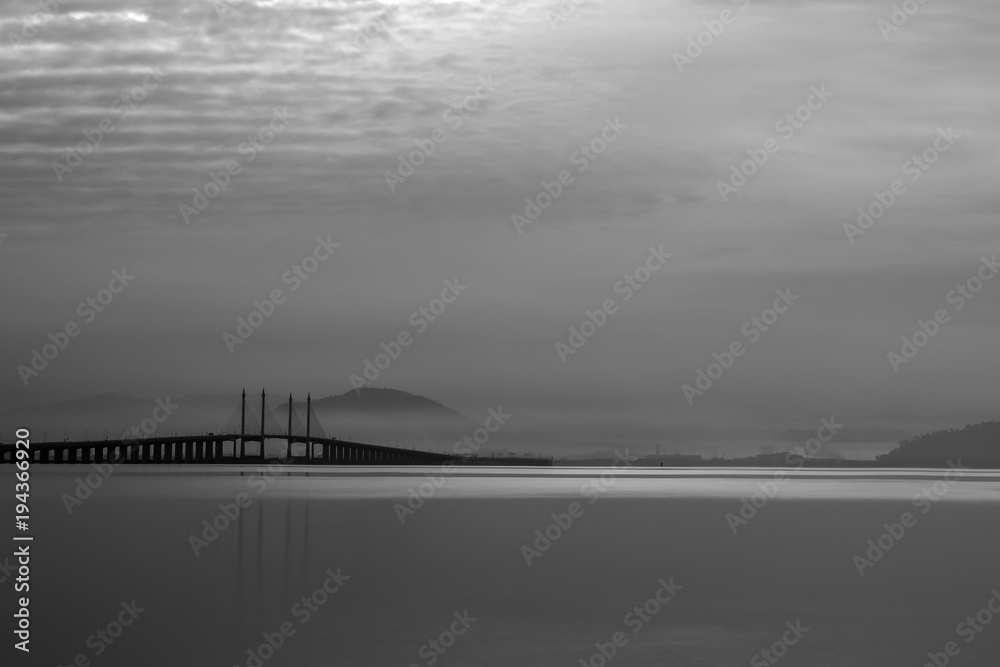 Fototapeta premium Silhouette of a distant hill in the early morning