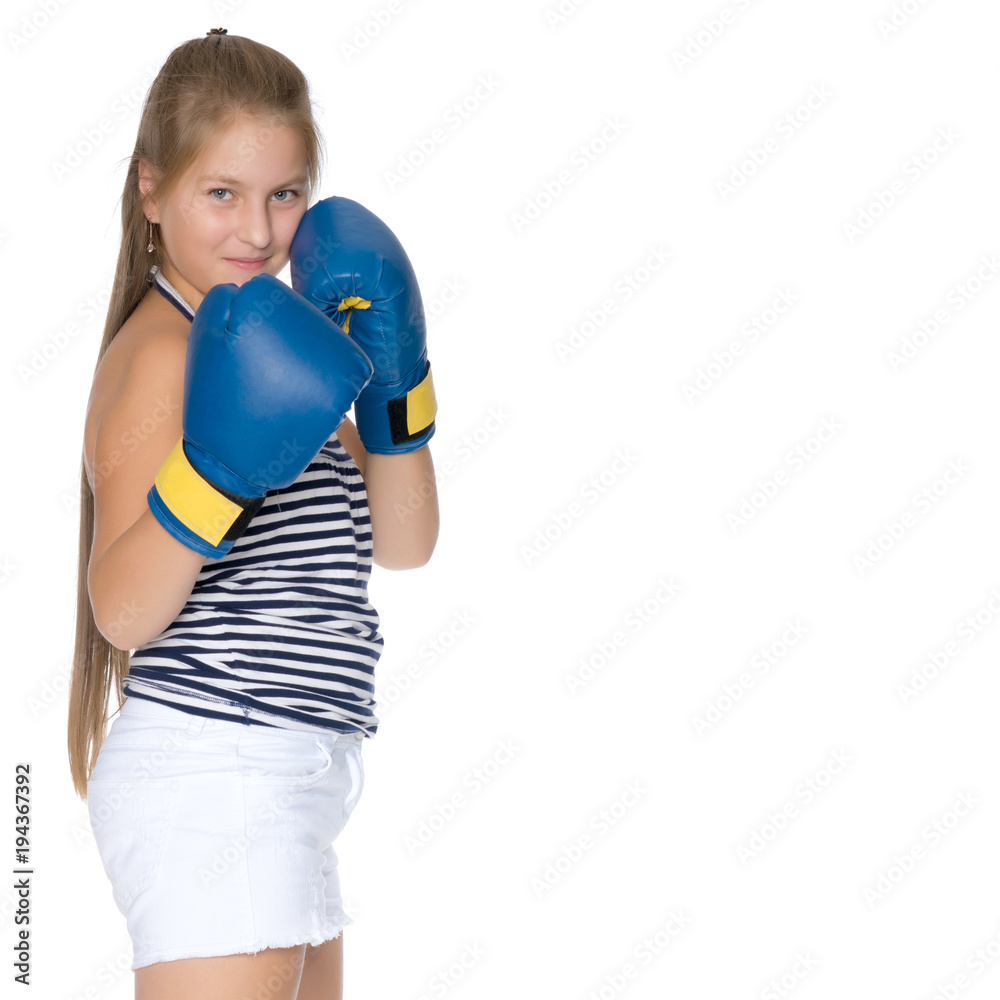 Teenage girl in boxing gloves.