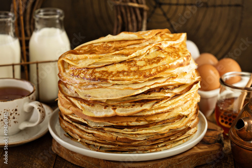 Big stack of homemade crepes or thin crepes