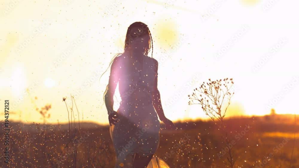 Woman with dress in the sunlight, slow motion