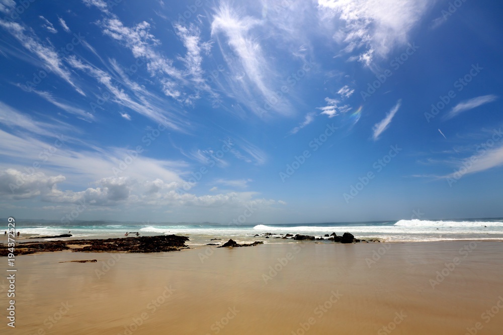 A sunny day as large surf and waves break at Snapper Rocks, located in Rainbow Bay on the Gold Coast of QLD Australia.