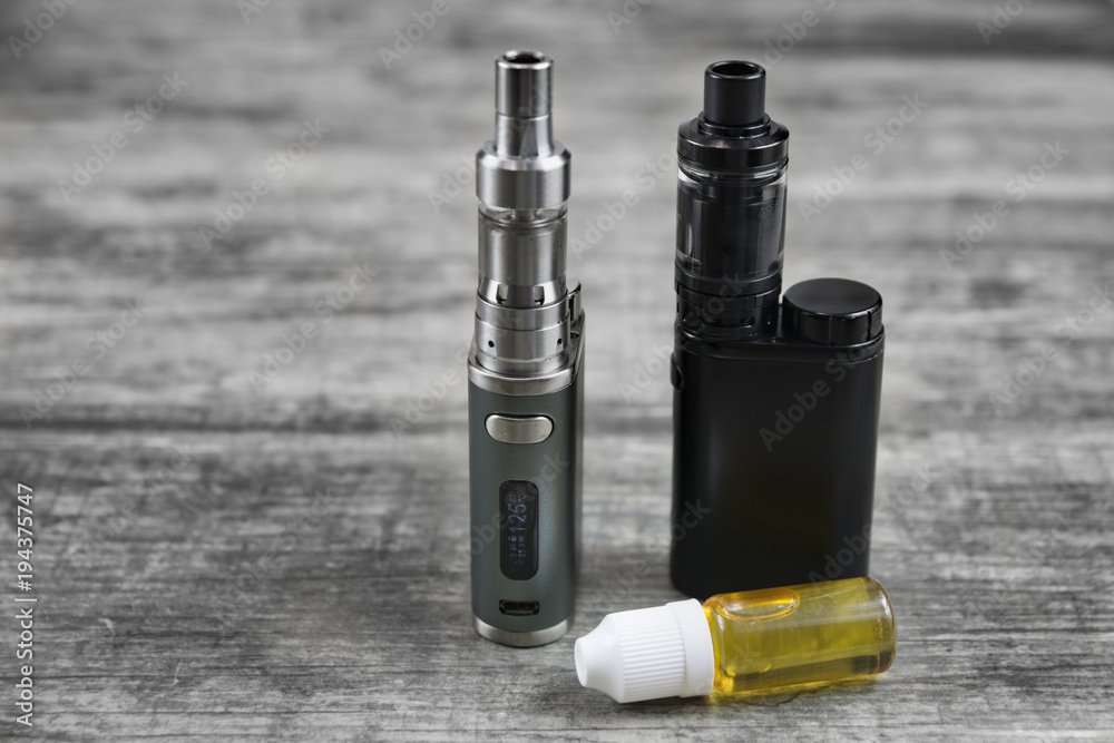 E - cigarette for vaping , technical devices.The liquid in the bottle E - cigarette for vaping , technical devices.The liquid in the bottle
