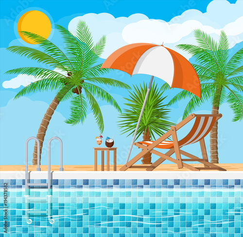 Swimming pool and lounger, palm tree