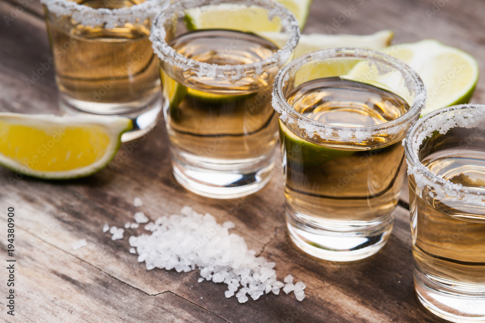Tequila shots with lime fruits and salt 
