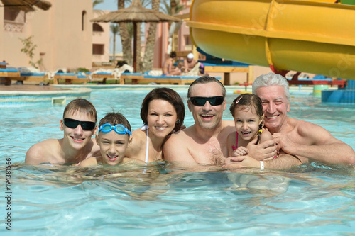 Family relax in pool