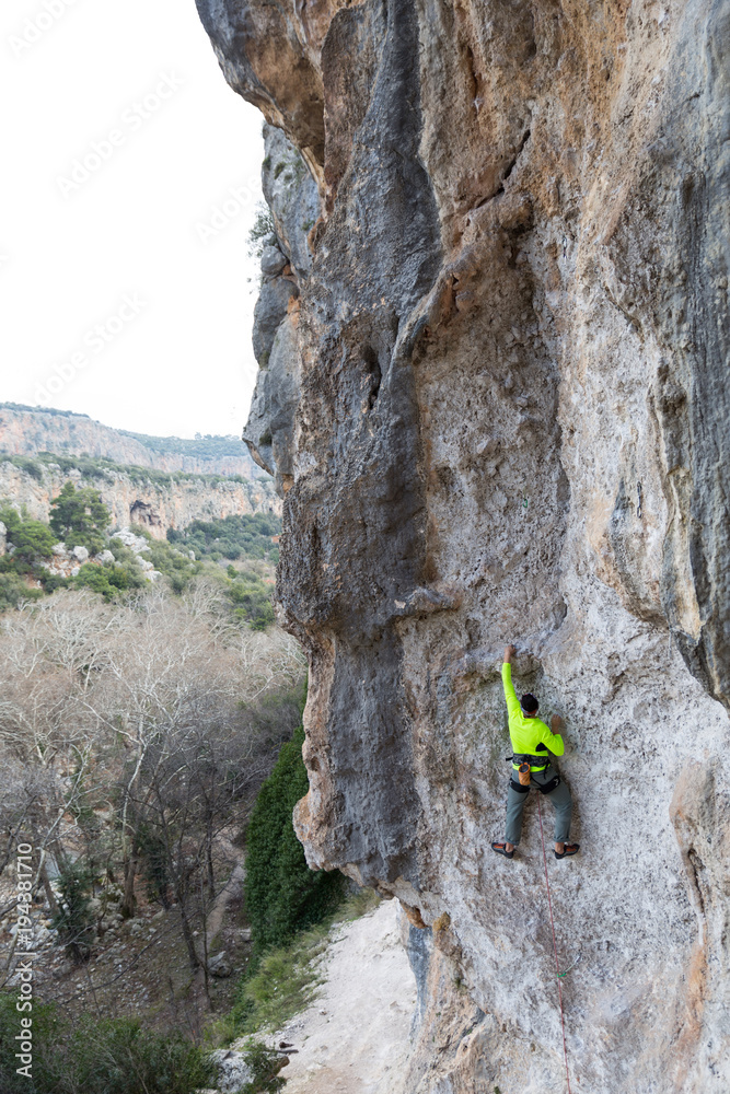 the climber on a route climbs in top
the climber on a route climbs in top