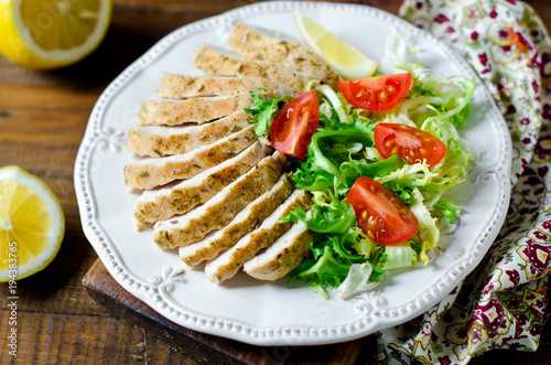 Grilled chicken breast with lettuce and tomatoes. Healthy food. Diet