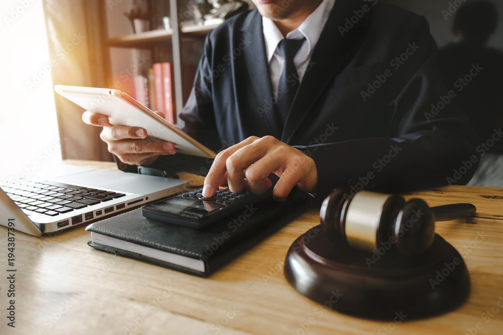 justice and law concept.Male judge in a courtroom the gavel,working with digital tablet computer on wood table in morning light
justice and law concept.Male judge in a courtroom the gavel,working with digital tablet computer on wood table in morning light