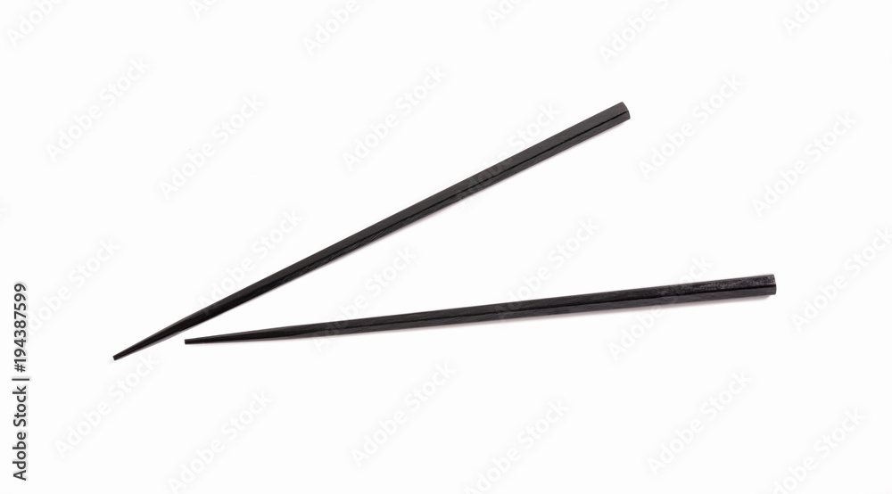 Black chopsticks on white background. Black chopsticks on white background.