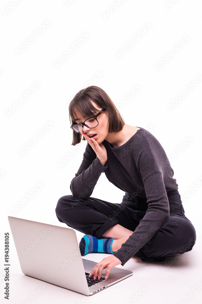 school, education, internet and technology concept - young teen girl sitting on the floor with laptop computer school, education, internet and technology concept - young teen girl sitting on the floor with laptop computer