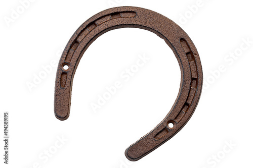 Lucky charm, st patricks day and luck of the irish concept with a horseshoe covered in rust isolated on white background with a clipping path included