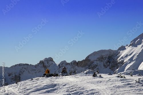 due sci alpinisti si riposano al sole 
dopo la salita photo