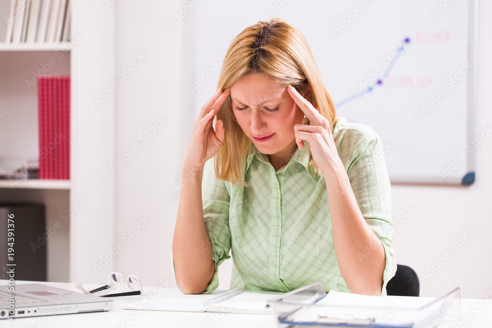 Businesswoman is having headache at work. Businesswoman is having headache at work.
