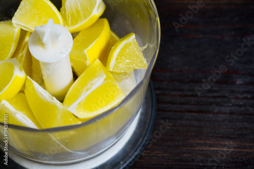 The lemon in the blender. Cooking lemon drink.