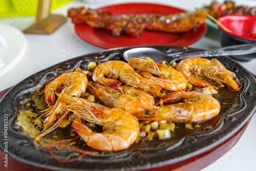 Famous food in the Philippines Butter Garlic Shrimp Sizzling Gambas © bugking88