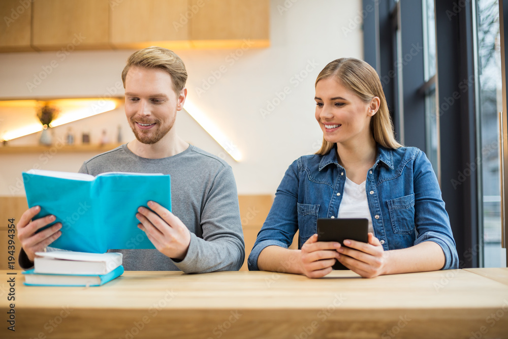 Nice positive man holding a book Nice positive man holding a book