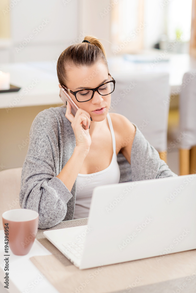 Young beautiful girl with a laptop at home Young beautiful girl with a laptop at home