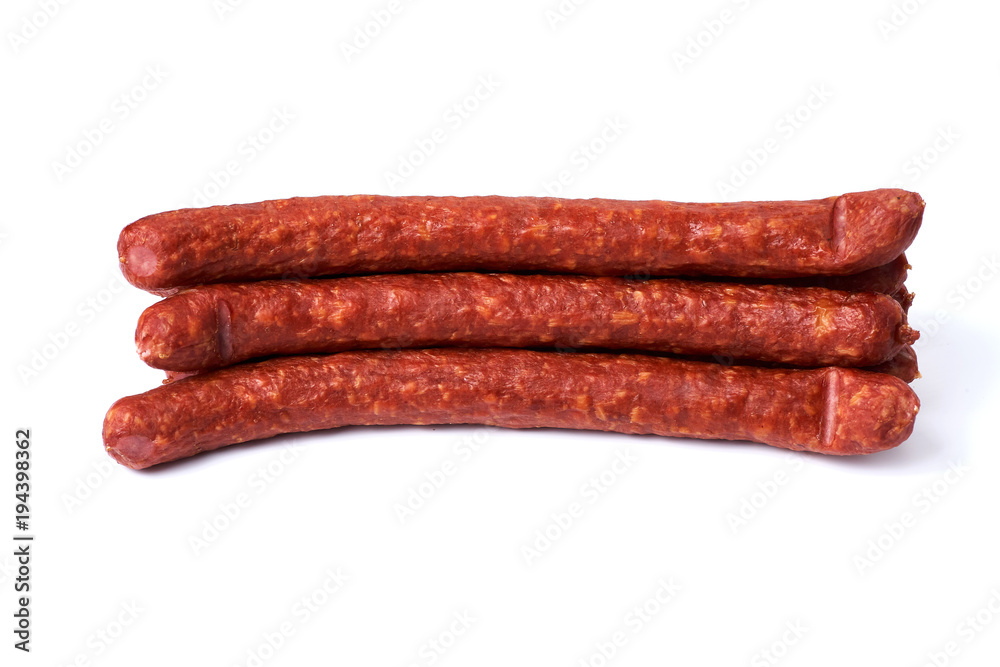 Thin smoked sausages isolated on a white background Thin smoked sausages isolated on a white background