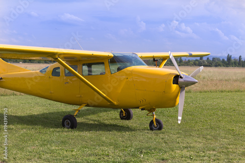 Small and Light Yellow Piper Aircraft near to the Runaway Ready to Take Off
