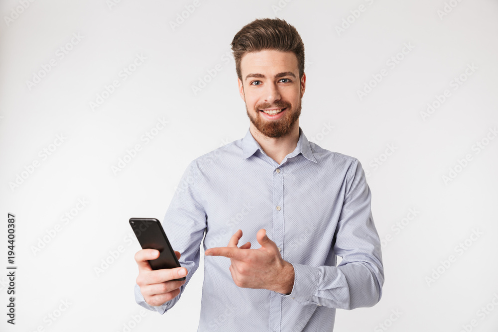Portrait of a smiling young man dressed in shirt
