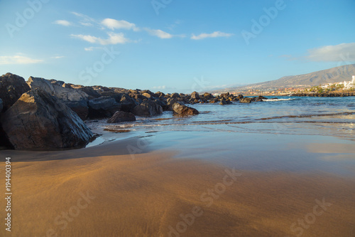 Canary Islands. Beautiful beaches on a sunny day on the island of Tenerife. Shores of the atlantic ocean.