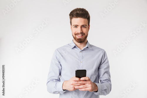 Portrait of a happy young man dressed in shirt